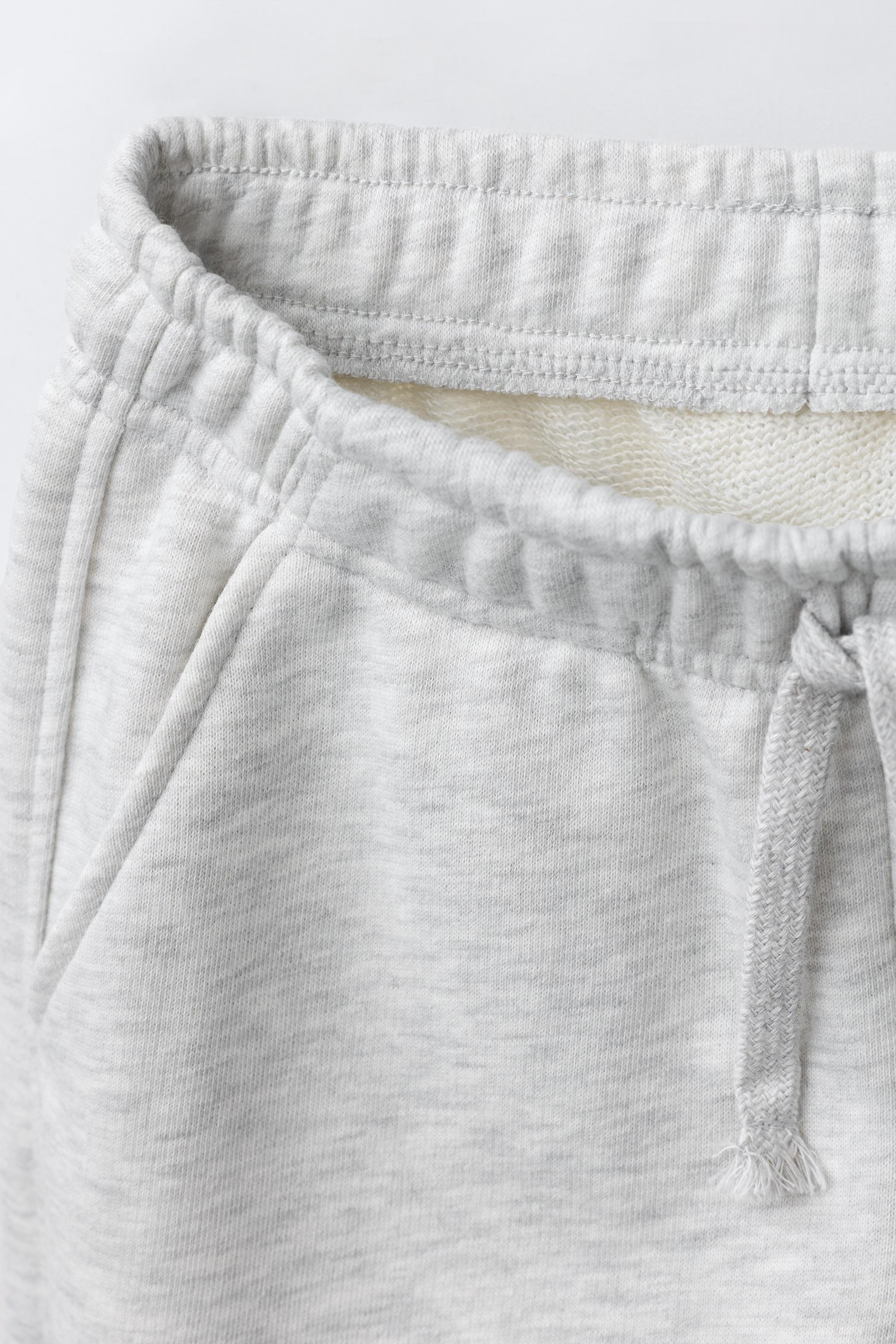 PANTALON EN MOLLETON À JAMBES LARGES ÉTOILES